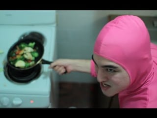 Pink guy cooks stir fry and raps
