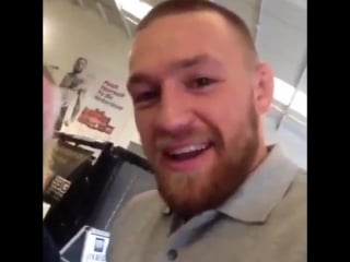 Conor mcgregor congratulating youngster glen mccauley for signing with liverpool fc