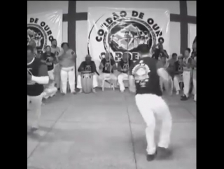 Mestre bocão and mestre virgulino doing a capoeira show at the batizado in goiania