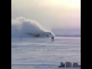 Amazing landing of a b757 touching down on a snowy russian field