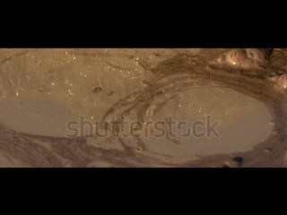 Stock footage slow motion mud volcanoes close shot strange red epic active mud volcanoes strange texture