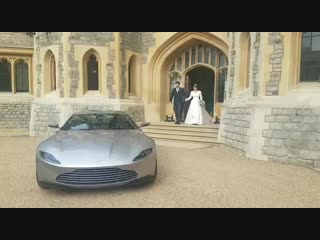 The newly married couple, princess eugenie and jack brooksbank, depart from their afternoon reception they left in an aston mar