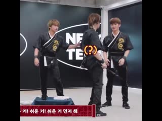 Yuta went to stand besides mark but haechan directed him to his own spot again