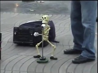 Skeleton puppet dances the twist