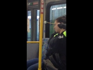 Candid voyeur of woman stretching & yawning on bus