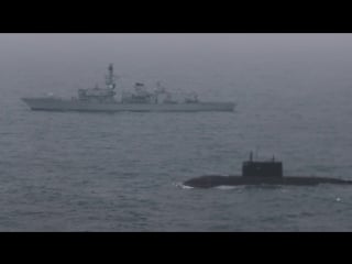 Hms somerset escorts russian submarine