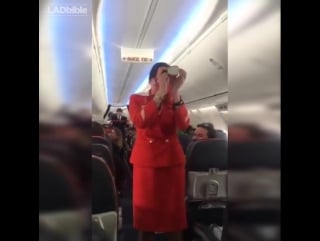 Football fans on flight distracting the air hostess doing the safety announcement 🔊