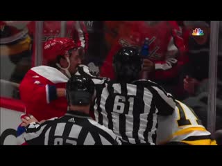 Evgeni malkin and brenden dillon keep fighting as referee tries to separate them