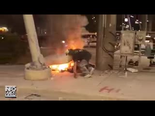 Rioters cheers as they burn down homeless man's belongings like what the fuck is wrong with these people