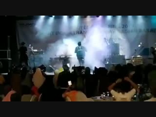 Tsunami wave crashes into a venue while a band performs in indonesia