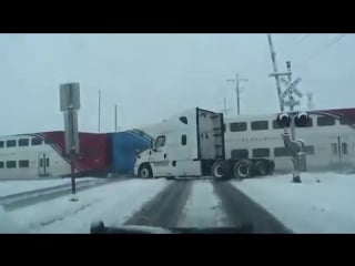 Train crashes into fedex truck and cuts it in two