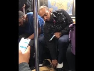 The man on the right took his sneakers off and gave them without hesitation to a barefooted homeless man on the subway, before p