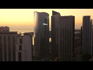 Aerial upward sunrise river buildings orange sky buenos aires argentina quarantine drone 4k 16x9 6885