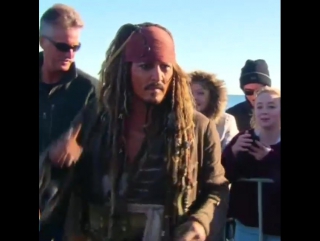 Locals on brisbanes bayside getting selfies with captain jack sparrow, 2 june 2