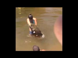 Girl catches fish with bare hands