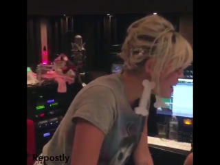 Miley in the studio in may, last year, recording 'we a famly'