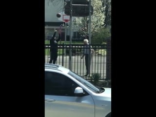 Two men, separated by a generation, playing basketball together