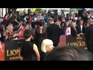 The duke and duchess of sussex have been spotted talking with fans at the european premiere of the lion king