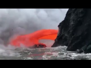 Boat full of tourists just inches away from molten lava as it spewed into sea in spectacular footage