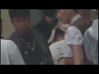 Long ge hard at work on set of the rebel with script reading discussions gestures with the director