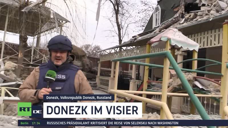 Donezk zerstörte gebäude und verletzte beamte durch ukrainischen beschuss