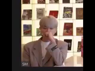 Baekhyun trying to keep his yawn in