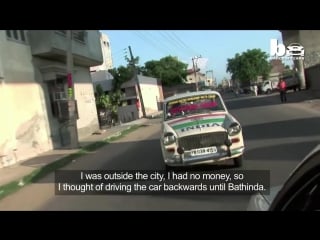 Reverse driver indian man drives car backwards on busy highways