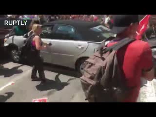 Moment car ploughs into protesters at charlottesville rally (extremely graphic)