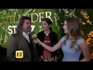 'outlander' bosses & stars reveal why jamie and claire's initials scene was cut from season 3! (exclusive) ет