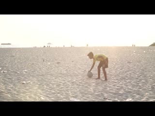 Boys playing football at the beach at sunset in kerala 1585848632811