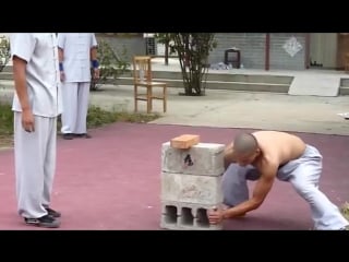Shaolin kungfu demonstration breaking iron and bricks