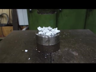 Crushing golf ball with hydraulic press