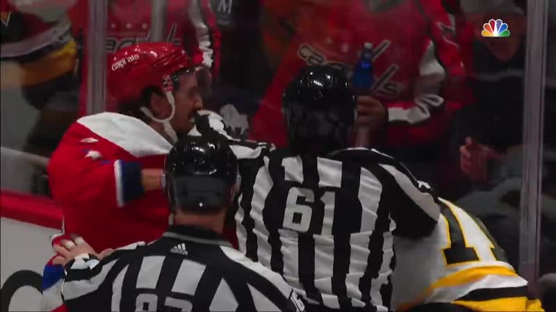 Evgeni malkin and brenden dillon keep fighting as referee tries to separate them
