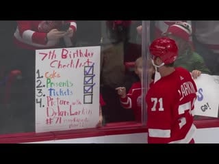 Dylan larkin gifts puck to young girl celebrating her seventh birthday