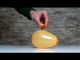 Popping balloon with orange