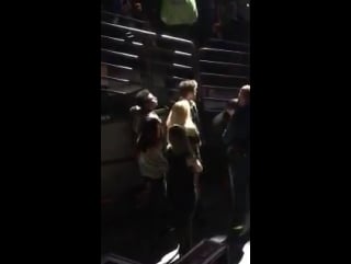 Niall watching shawnmendes set at jingleball at td garden in boston!