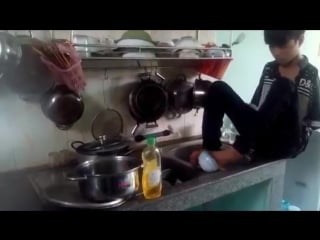 Sleeveless boy climb trees, peeled mango footed