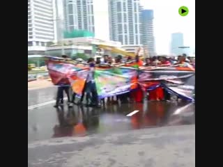 Buddhist monks fought police water cannon and tear gas