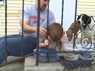 Boy stuck in fence