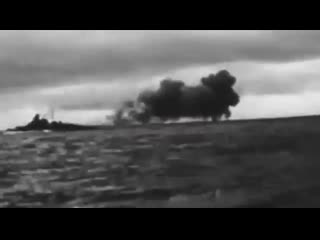 Footage of the german battleship bismarck firing her guns on the british battlecruiser hms hood during the battle of the denmark