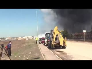 Tank explosion at a chemical factory sends a large piece of debris flying