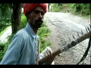 Rajasthani busker playing ravanhatta at dharamkot