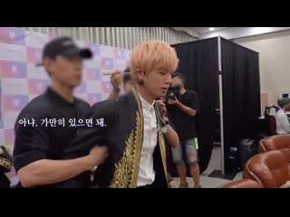 Staff asked seokjin to be calm but seokjin refused so he should held his arms im