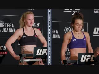 Side by side look at valentina shevchenko and joanna jedrzejczyk stepping on the scale thi