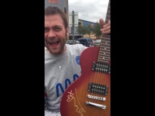 Tom meighan has signed a guitar for summer ball auction