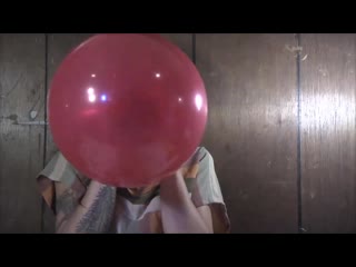 Artsy girl blows to pop balloons warped sound