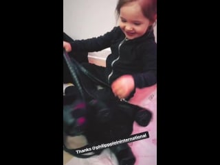 Ioni shows her backpack