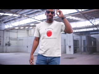 Middle aged black man wearing a round neck tee video mockup in a warehouse a13120 mp4