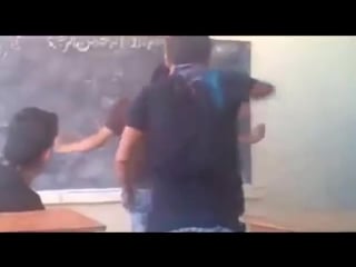 Afghan boys dancing in a classroom