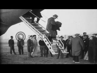 Uss macon is attached to a mooring mast and passengers come ashore in akron, stock footage